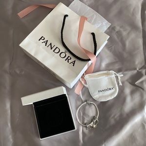 Pandora bracelet with charm and safety size 7.1 in.